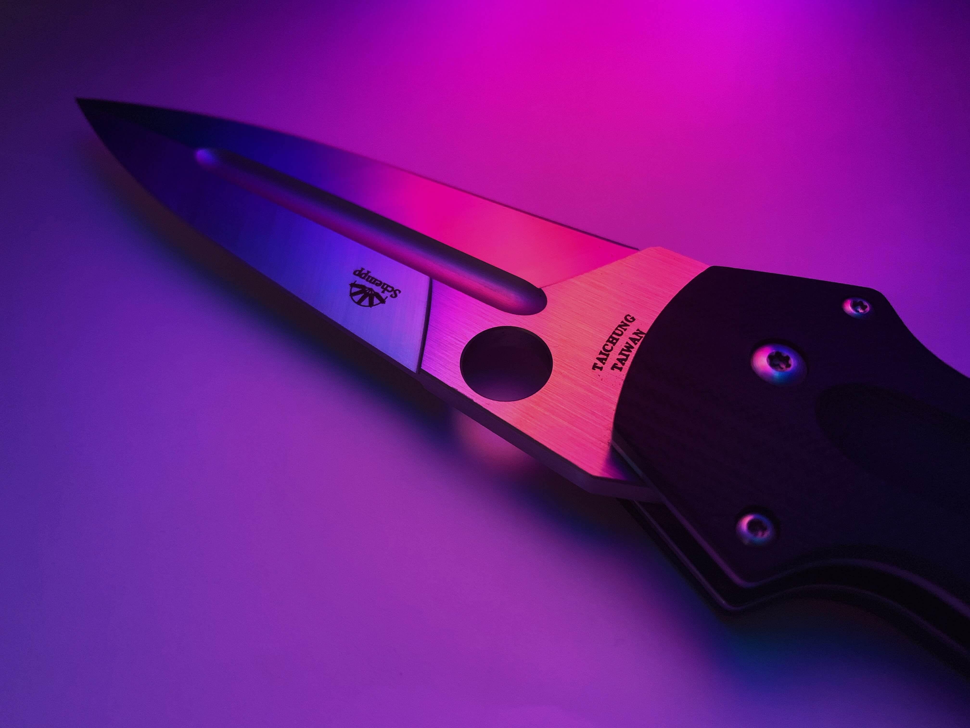 spring knife in purple light
