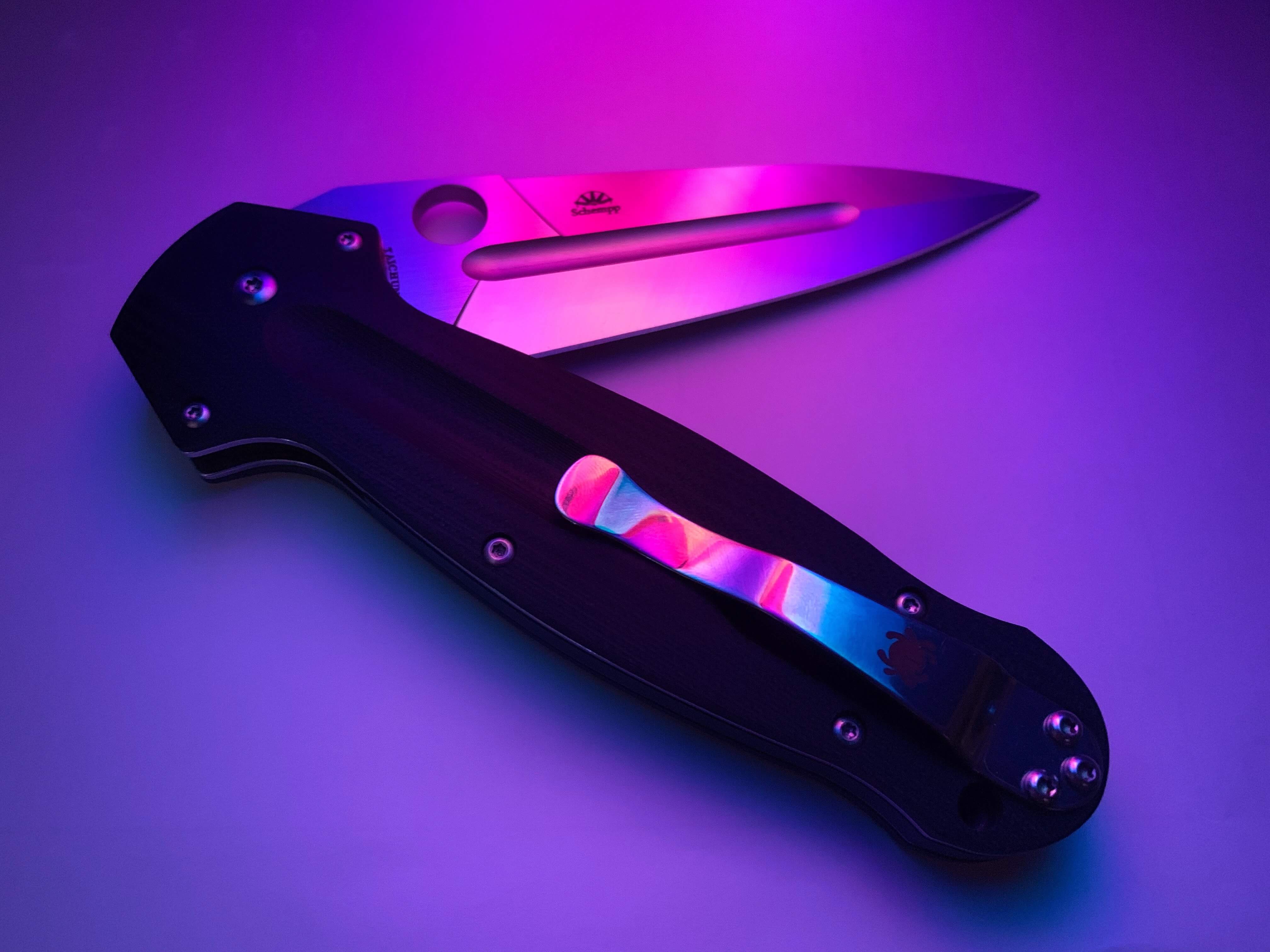 folding knife in pink light